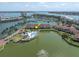 Expansive aerial view of lakefront condos and pool with nearby city views at 6100 Bahia Del Mar Cir # 105, St Petersburg, FL 33715