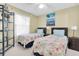 Inviting bedroom with twin beds, a ceiling fan, and a bright window for a comfortable living space at 6100 Bahia Del Mar Cir # 105, St Petersburg, FL 33715