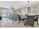 An open-concept dining area with natural light, adjacent to the living room at 6100 Bahia Del Mar Cir # 105, St Petersburg, FL 33715