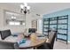 Charming dining area with a round table, seating for four, and stylish coastal decorations at 6100 Bahia Del Mar Cir # 105, St Petersburg, FL 33715