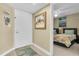 A tidy entryway and wall art which leads into a bedroom at 6100 Bahia Del Mar Cir # 105, St Petersburg, FL 33715