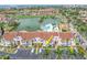 A view of the condo's facade, showing the entrance, parking, and landscaping at 6100 Bahia Del Mar Cir # 105, St Petersburg, FL 33715