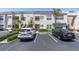 Well-maintained condo exterior showcasing updated landscaping and convenient parking at 6100 Bahia Del Mar Cir # 105, St Petersburg, FL 33715