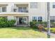 Charming condo featuring a cozy patio with lush green landscaping and outdoor seating area at 6100 Bahia Del Mar Cir # 105, St Petersburg, FL 33715