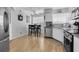 Bright kitchen featuring stainless steel appliances, white cabinets, and a cozy breakfast nook at 6100 Bahia Del Mar Cir # 105, St Petersburg, FL 33715