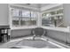Kitchen sink area with granite countertops and a bright window overlooking lush greenery at 6100 Bahia Del Mar Cir # 105, St Petersburg, FL 33715