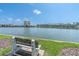 Breathtaking waterfront view, showcasing the serene lake and surrounding buildings at 6100 Bahia Del Mar Cir # 105, St Petersburg, FL 33715