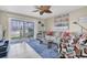 A comfortable living room with a sliding glass door to the lanai at 6100 Bahia Del Mar Cir # 105, St Petersburg, FL 33715