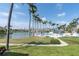 Resort style pool and sundeck overlooking a beautiful lake and swaying palms at 6100 Bahia Del Mar Cir # 105, St Petersburg, FL 33715