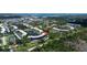 Expansive aerial view of the condo complex with mature trees and serene water features enhancing the community's appeal at 6190 80Th N St # 102, St Petersburg, FL 33709