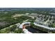 Aerial view showcasing the building location with pond and trees surrounding the property at 6190 80Th N St # 102, St Petersburg, FL 33709
