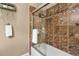 Well-lit bathroom showing tile shower with glass door and shower head at 6190 80Th N St # 102, St Petersburg, FL 33709