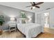 The bedroom features a ceiling fan and coordinated decor for a cohesive and relaxing atmosphere at 6190 80Th N St # 102, St Petersburg, FL 33709