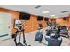 Well-equipped fitness center featuring modern cardio machines and wall-mounted televisions at 6190 80Th N St # 102, St Petersburg, FL 33709