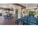 Community grilling area with picnic tables, ceiling fans, and a built-in grill at 6190 80Th N St # 102, St Petersburg, FL 33709