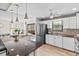 Modern kitchen featuring a center island with seating, stainless steel appliances, and ample cabinet space at 6190 80Th N St # 102, St Petersburg, FL 33709