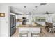 Modern kitchen featuring a center island with seating, stainless steel appliances, and ample cabinet space at 6190 80Th N St # 102, St Petersburg, FL 33709