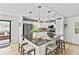 Modern kitchen featuring a center island with seating, stainless steel appliances, and ample cabinet space at 6190 80Th N St # 102, St Petersburg, FL 33709