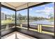 Relax on this screened lanai with serene lake views, perfect for enjoying nature and the beautiful sky at 6190 80Th N St # 102, St Petersburg, FL 33709