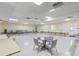 Large, bright meeting room with tables, chairs, and ample space for gatherings and events at 6190 80Th N St # 102, St Petersburg, FL 33709