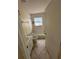 Simple bathroom with tiled floor, single sink, and tub and shower combination at 650 Palm Pl, Safety Harbor, FL 34695