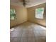 Secondary bedroom featuring neutral walls and tiled floors at 650 Palm Pl, Safety Harbor, FL 34695