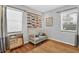 Bedroom room with a white crib, wooden floors, blinds on the window, and nautical fish decor at 6713 31St N Ave, St Petersburg, FL 33710