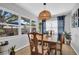 Charming dining room with a wooden table set, complemented by natural light and cozy decor at 6713 31St N Ave, St Petersburg, FL 33710