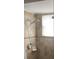 Bathroom featuring a tiled shower with a rainfall showerhead and a window for natural light at 7524 Oakshire Dr, Port Richey, FL 34668