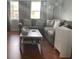 Cozy living room features a comfortable sectional sofa, and neutral decor, perfect for relaxation at 7524 Oakshire Dr, Port Richey, FL 34668