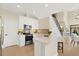 Modern kitchen boasts stainless steel appliances, sleek white cabinetry, and a breakfast bar at 7798 93Rd N St # 1, Seminole, FL 33777