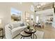 Bright living room with soaring ceilings, large windows, open floorplan, and stylish contemporary design at 7798 93Rd N St # 1, Seminole, FL 33777