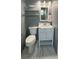 Cozy bathroom with modern vanity, stylish mirror, and patterned tile floor at 821 Karen, Palm Harbor, FL 34684