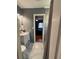 Well-lit bathroom featuring stylish vanity, and a shower with gray curtain, creating a serene and functional space at 821 Karen St, Palm Harbor, FL 34684