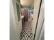 Bathroom with tile floor, tub and shower combination, linen closet, and white painted trim at 821 Karen St, Palm Harbor, FL 34684