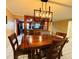 Bright dining room featuring a wooden dining table, and stylish lighting at 821 Karen St, Palm Harbor, FL 34684