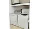 Functional laundry room with updated washer and dryer units, ideal for convenient chore management at 821 Karen St, Palm Harbor, FL 34684