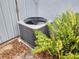 Exterior shot of the AC unit with surrounding greenery at 8503 N Willow Ave, Tampa, FL 33604