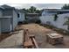 The backyard features an outdoor fire pit, seating, and an adjacent storage shed at 8503 N Willow Ave, Tampa, FL 33604