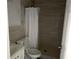 Neutral bathroom with tile flooring, walk-in shower, toilet, and white tile at 8503 N Willow Ave, Tampa, FL 33604