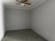 Bedroom showcasing a ceiling fan, neutral walls, and neutral flooring at 8503 N Willow Ave, Tampa, FL 33604