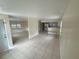 Spacious living room with tiled floors and a combined kitchenette area at 8503 N Willow Ave, Tampa, FL 33604