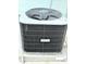 Comfortmaker central air conditioning unit with protective cage for energy-efficient home climate control at 9005 Rainbow Ln, Port Richey, FL 34668