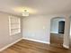 Neutral dining area with a built-in display shelf, modern lighting, and new flooring at 9005 Rainbow Ln, Port Richey, FL 34668