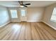 Light-filled living room featuring neutral decor and access to an outdoor patio/balcony at 9005 Rainbow Ln, Port Richey, FL 34668
