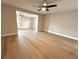 Open-concept living area featuring new flooring, neutral paint, and easy access to other rooms at 9005 Rainbow Ln, Port Richey, FL 34668