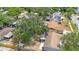 Backyard view, featuring a fenced yard and mature trees adding privacy at 9043 108Th Ave, Seminole, FL 33777