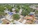 An aerial view of the neighborhood showcases the homes, tree coverage, and street layout at 9043 108Th Ave, Seminole, FL 33777