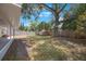 The home includes a spacious backyard with mature trees and privacy fence at 9043 108Th Ave, Seminole, FL 33777