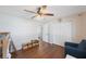 Spacious bedroom featuring a ceiling fan, closet doors, and an exit to the bathroom at 9043 108Th Ave, Seminole, FL 33777